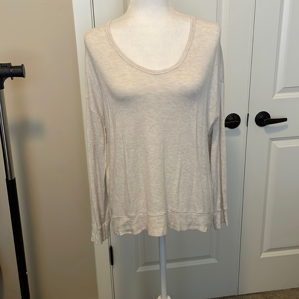 Cream long sleeve shirt.